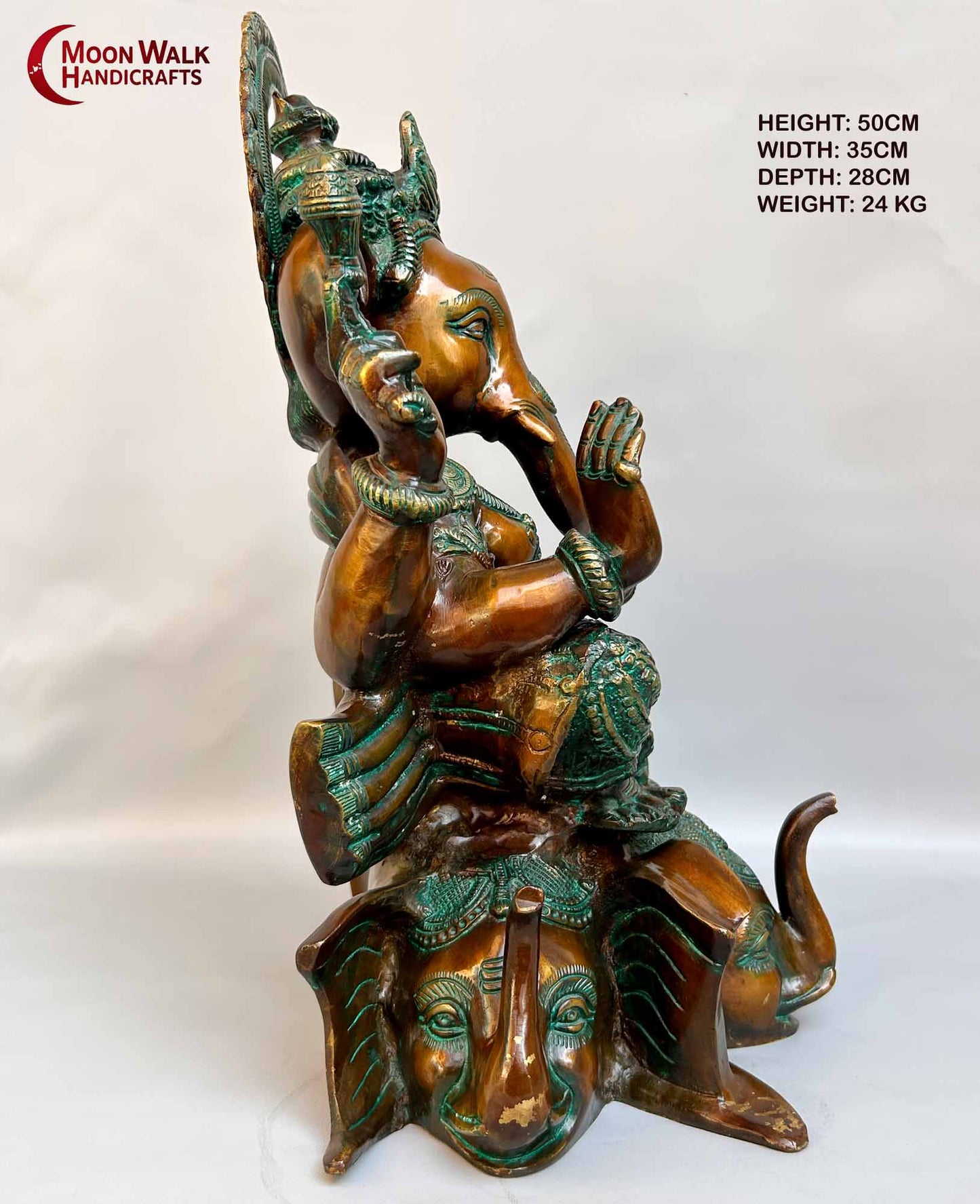 Rustic Brass Ganesh Statue seated on base with 3 Elephant Heads with trunks.