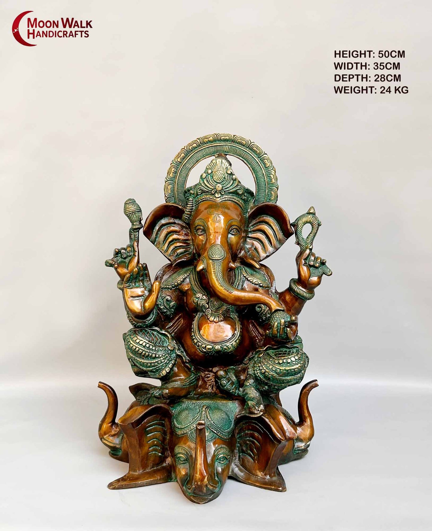 Rustic Brass Ganesh Statue seated on base with 3 Elephant Heads with trunks.