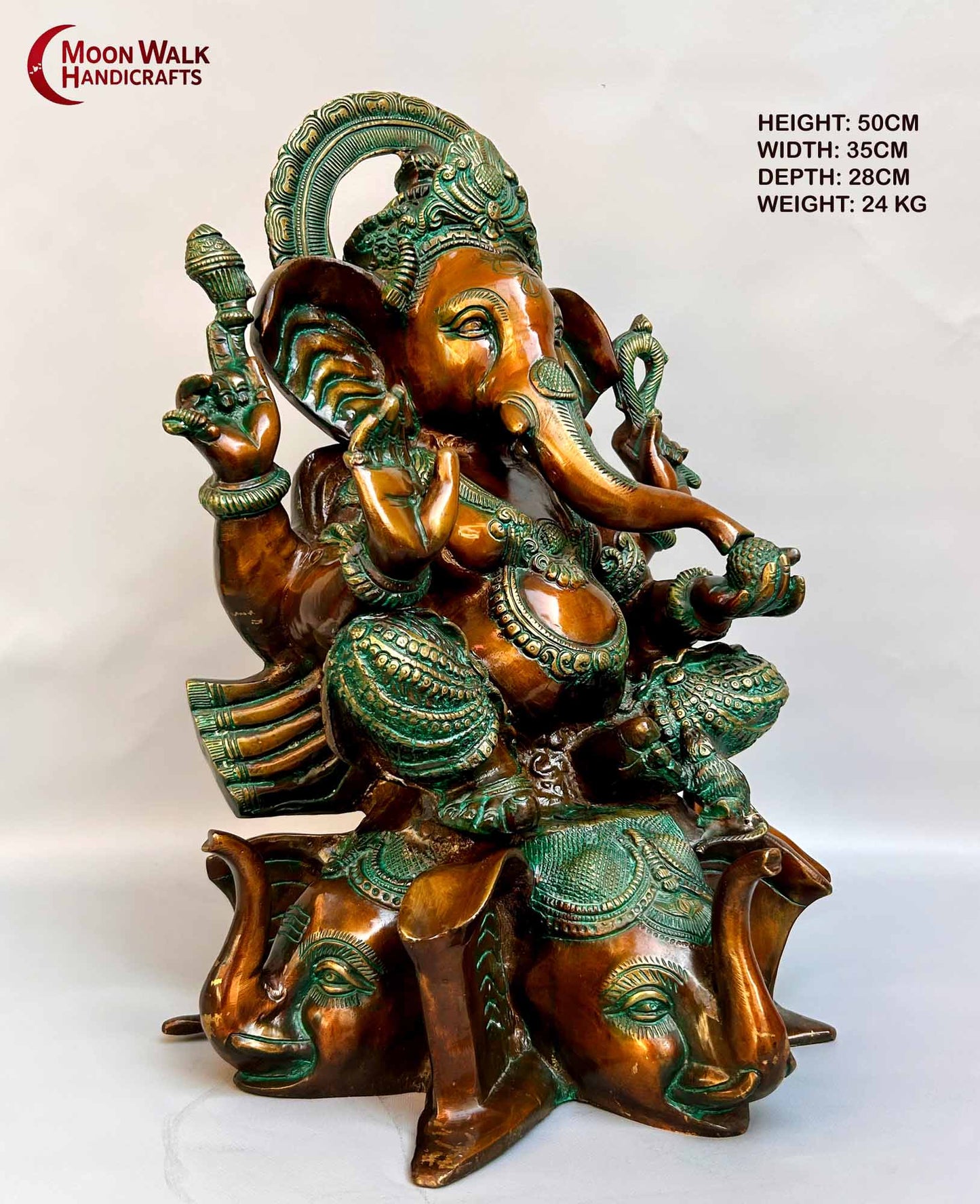 Rustic Brass Ganesh Statue seated on base with 3 Elephant Heads with trunks.