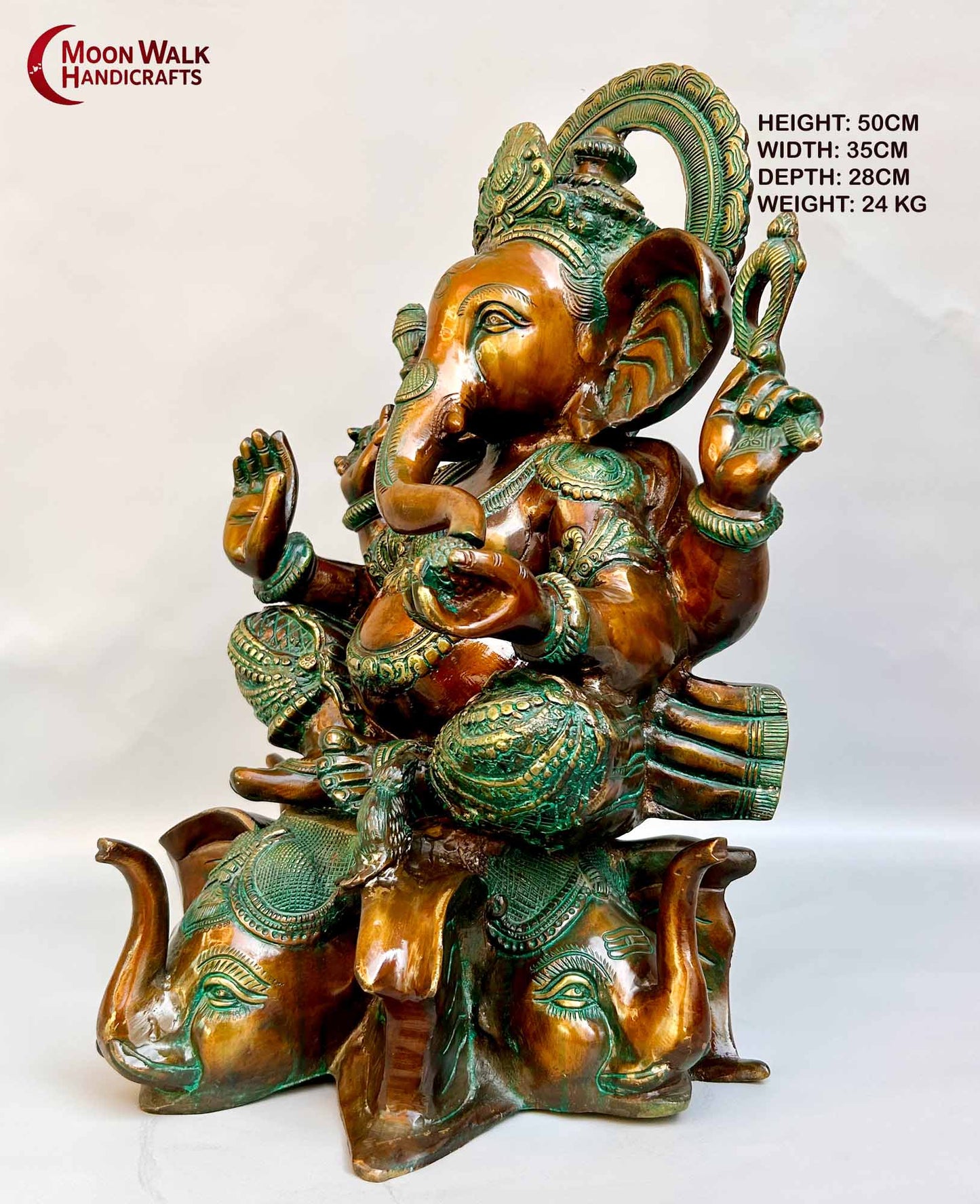 Rustic Brass Ganesh Statue seated on base with 3 Elephant Heads with trunks.