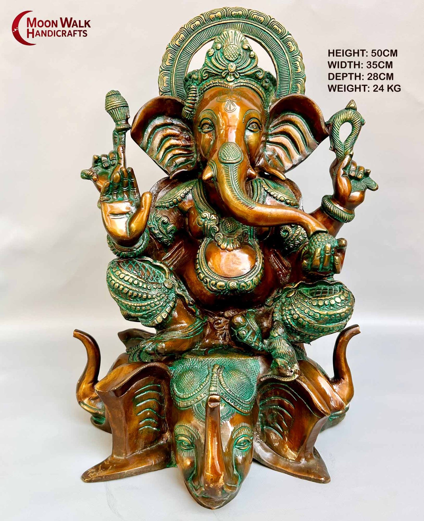 Rustic Brass Ganesh Statue seated on base with 3 Elephant Heads with trunks.
