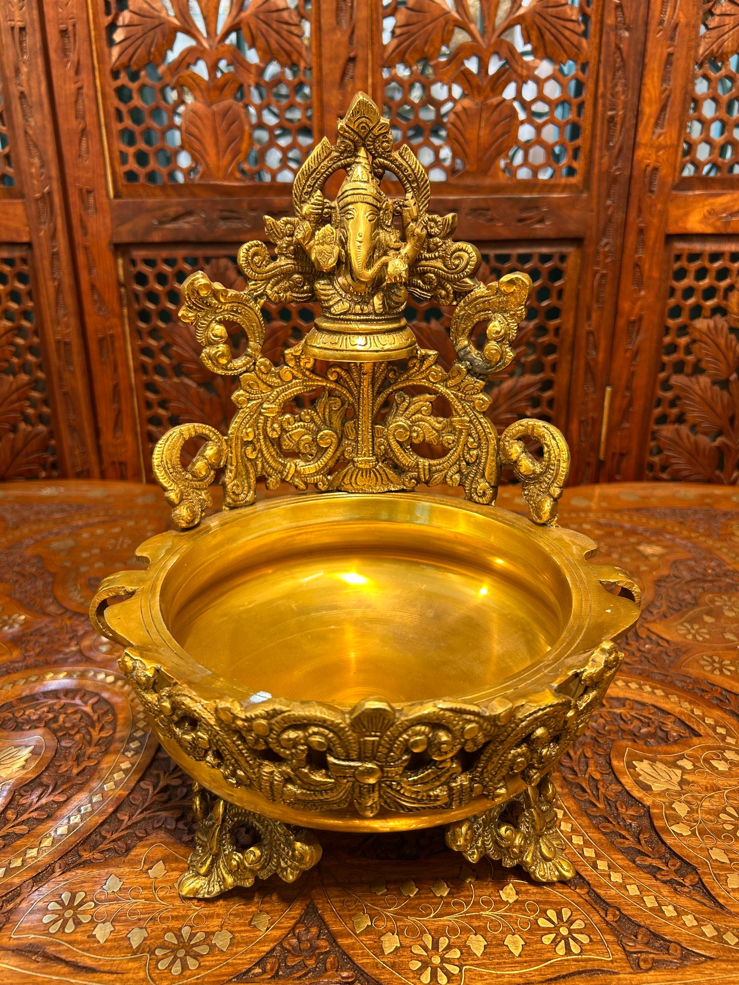 Exquisite brass Ganesha urli bowl with intricate carvings, ideal for home decor, pooja, festivals, or gifting, adding elegance and divine