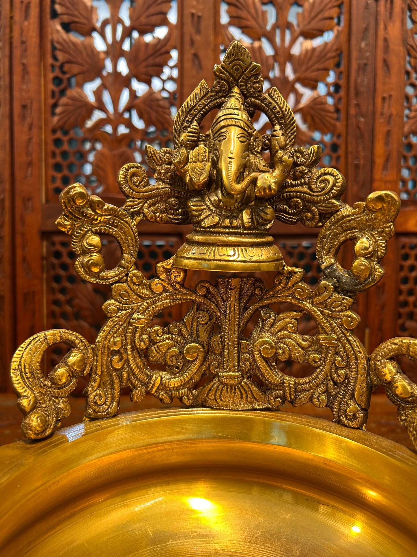 Exquisite brass Ganesha urli bowl with intricate carvings, ideal for home decor, pooja, festivals, or gifting, adding elegance and divine