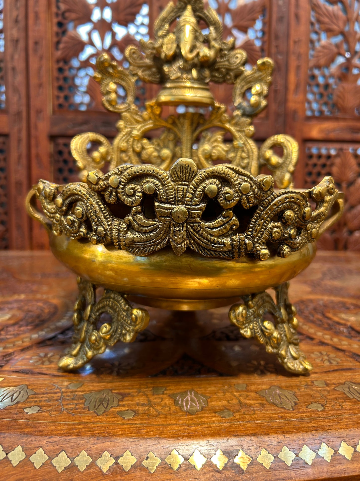 Exquisite brass Ganesha urli bowl with intricate carvings, ideal for home decor, pooja, festivals, or gifting, adding elegance and divine