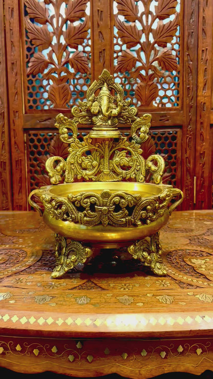 Exquisite brass Ganesha urli bowl with intricate carvings, ideal for home decor, pooja, festivals, or gifting, adding elegance and divine